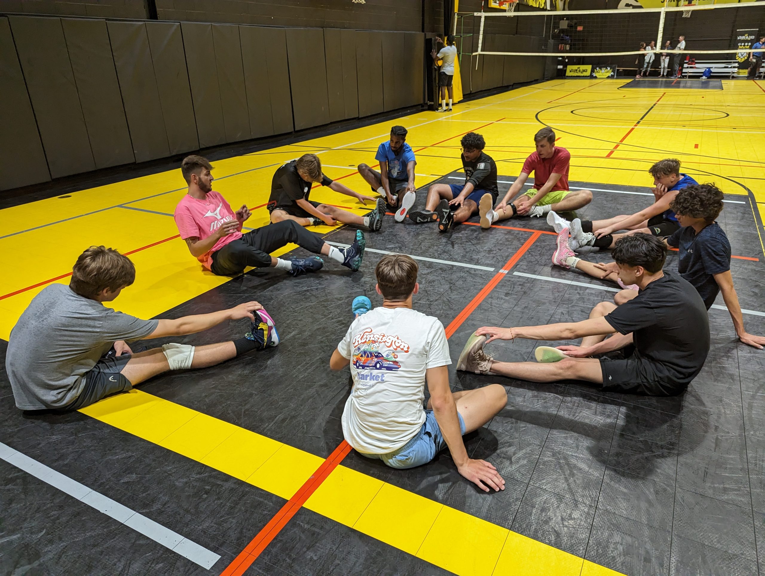 Volleyball players and coaches at Jungle Courts