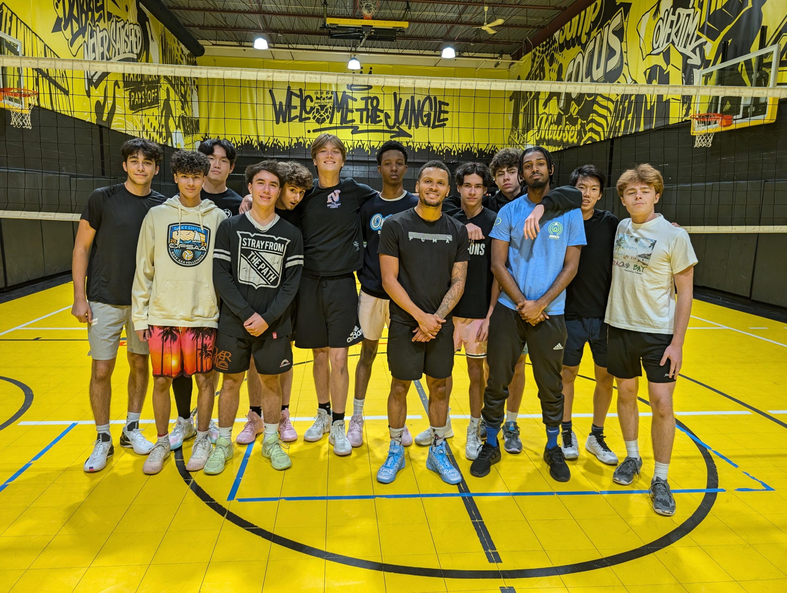 Volleyball group on the yellow indoor court at Jungle Courts in Pickering